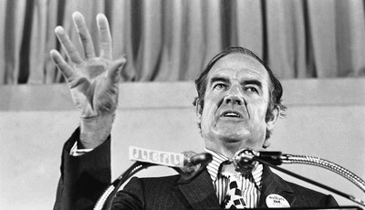 
              FILE - In this July 30, 1971 file photo, Sen. George McGovern gestures during his keynote address at the National Welfare Rights Organization convention at Brown University in  Providen